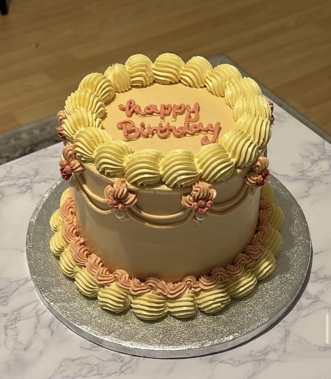 Peach and butter-yellow vintage cake with “Happy Birthday” piped on top (photo 1 of 2)
