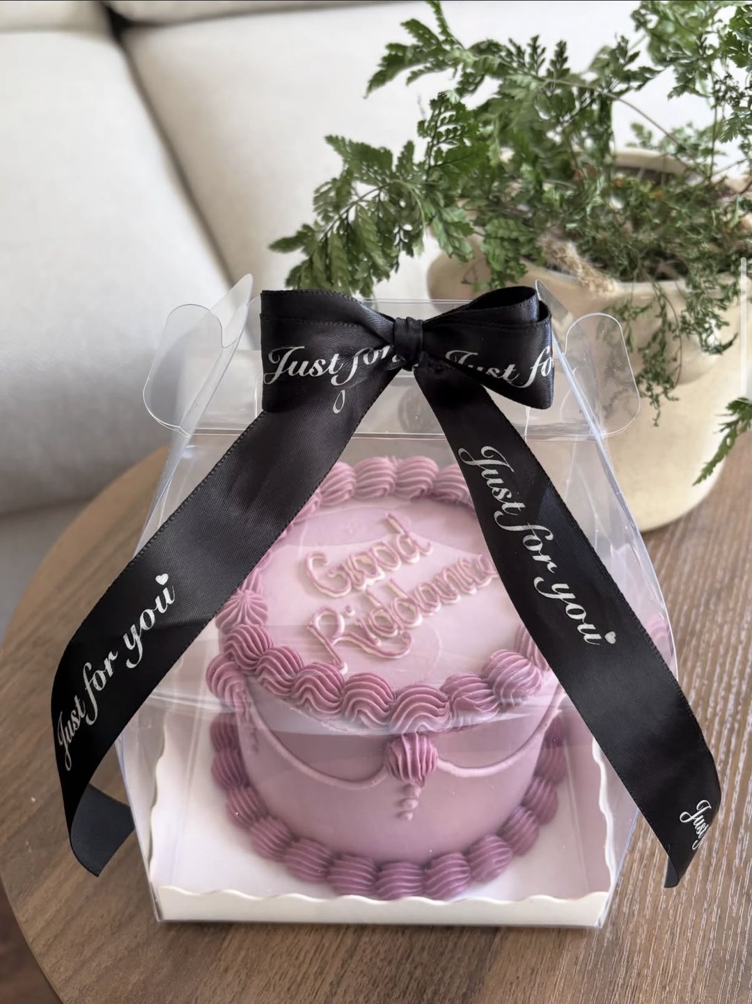Pink vintage bento cake in a clear gift box tied with a black “Just for you” satin ribbon